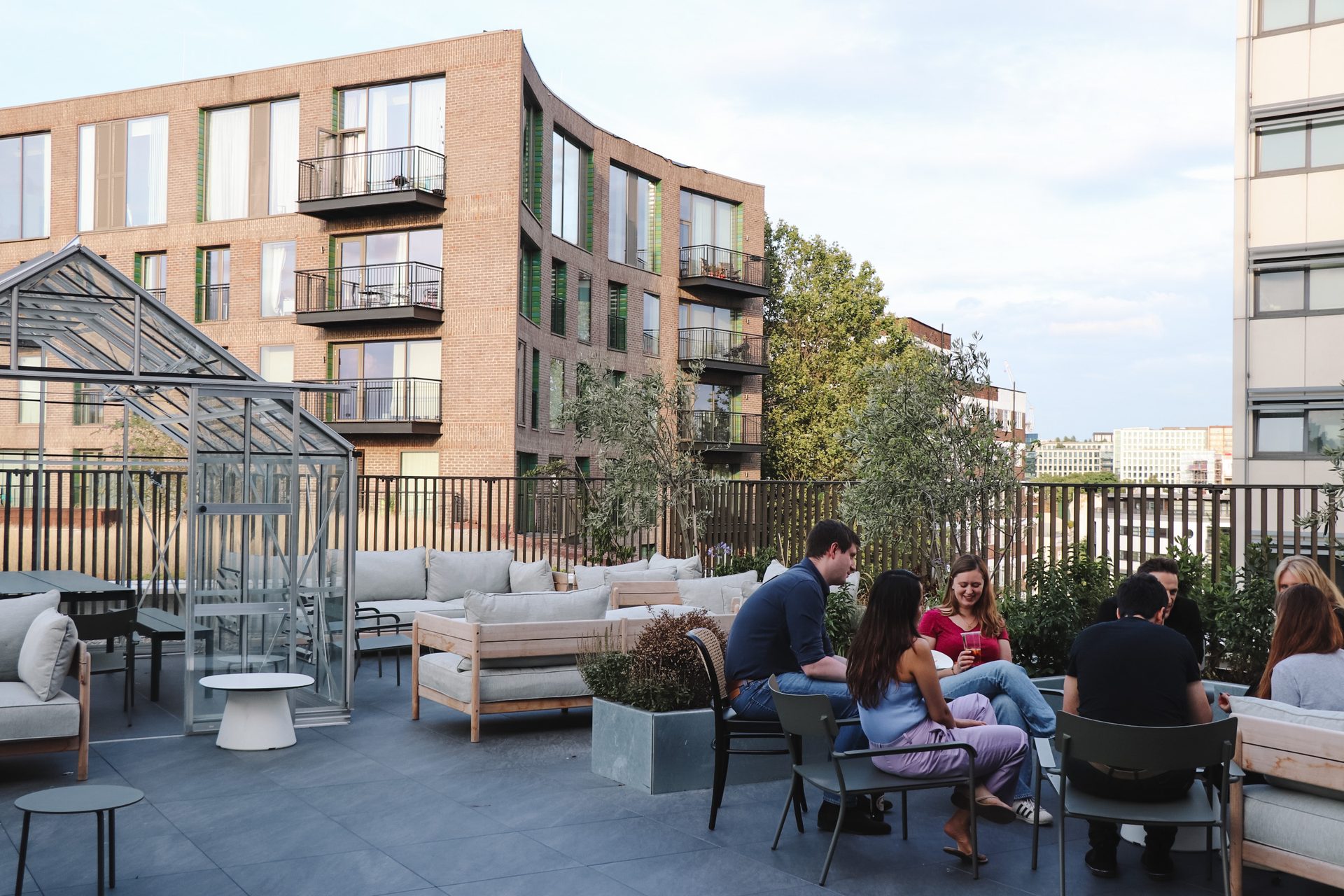 London Shared residents socialising on a rooftop terrace